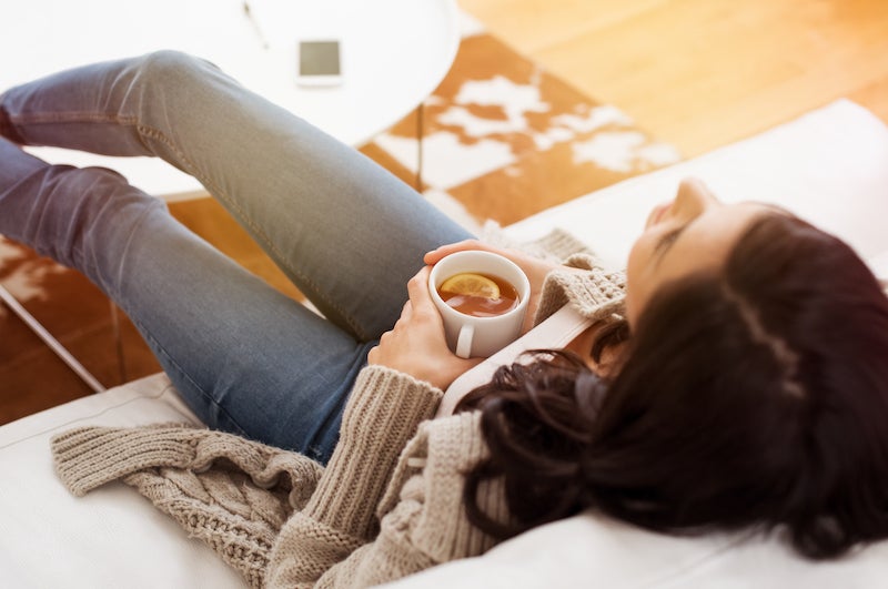 creator burnout - take a break - woman sitting back with some tea on a break