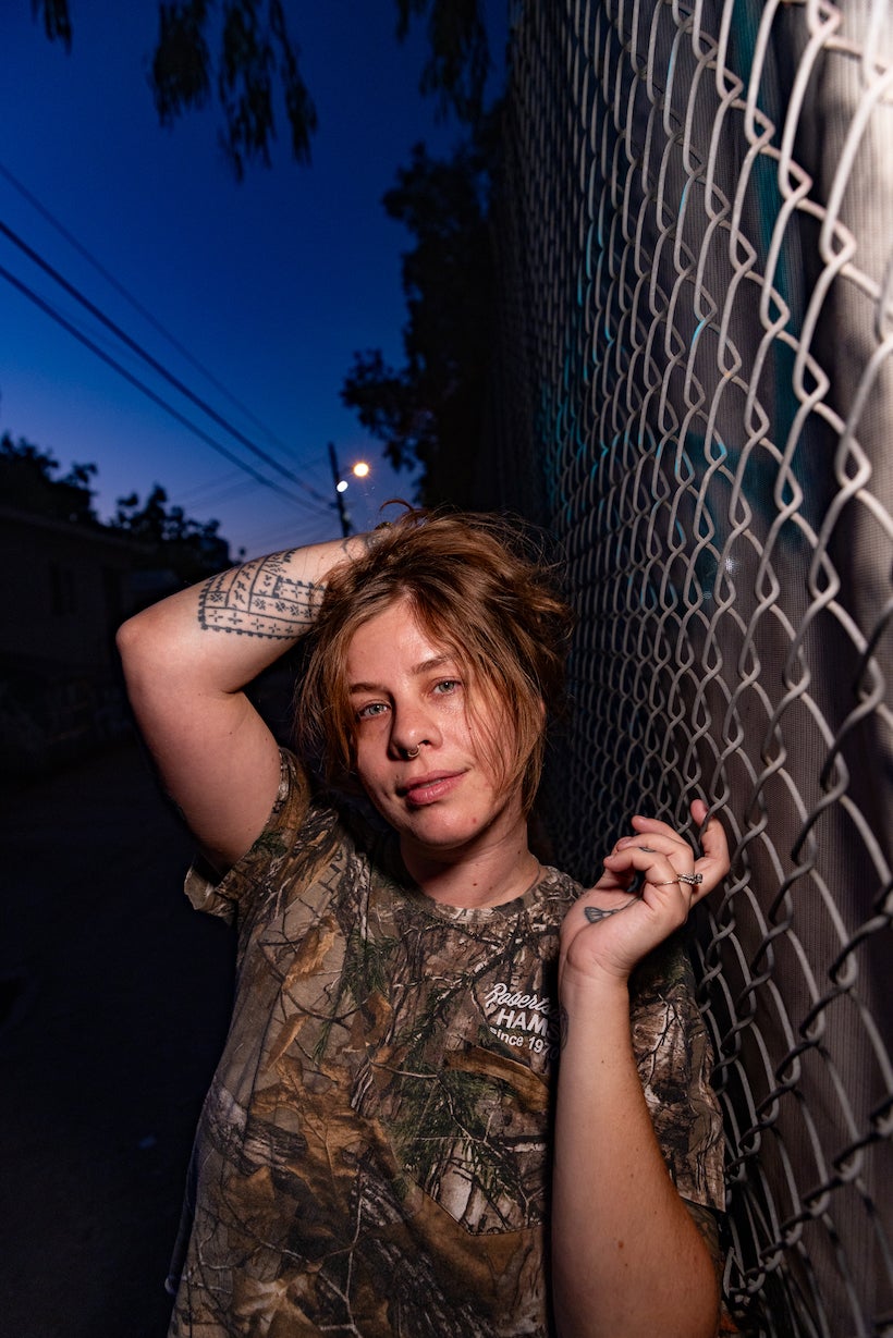rgb panel pro 2.0 - woman standing next to a chain link fence 