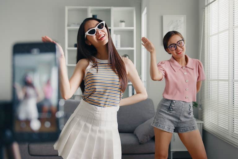 how to license music - women dancing for a video
