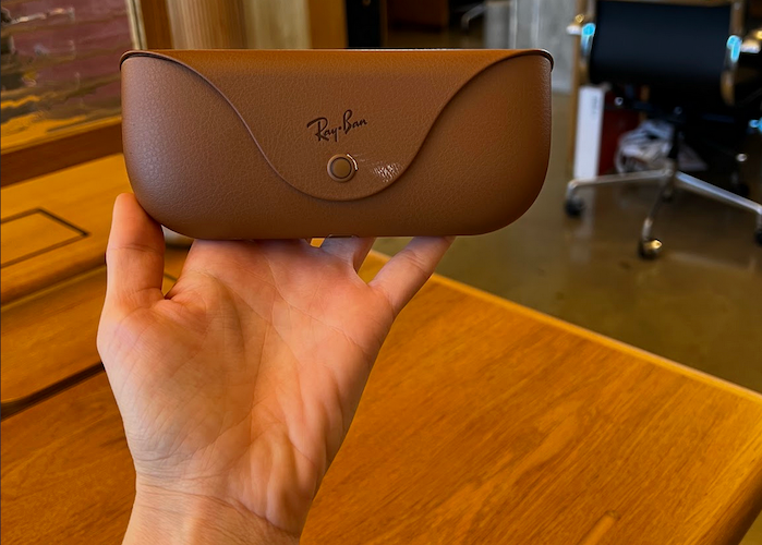 Holding up the Ray-Ban's meta smart glasses official glasses case