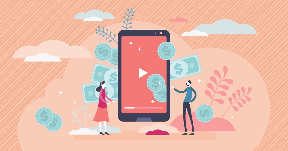 Creator Economy - two creators looking at a phone thinking of ways to expand their business