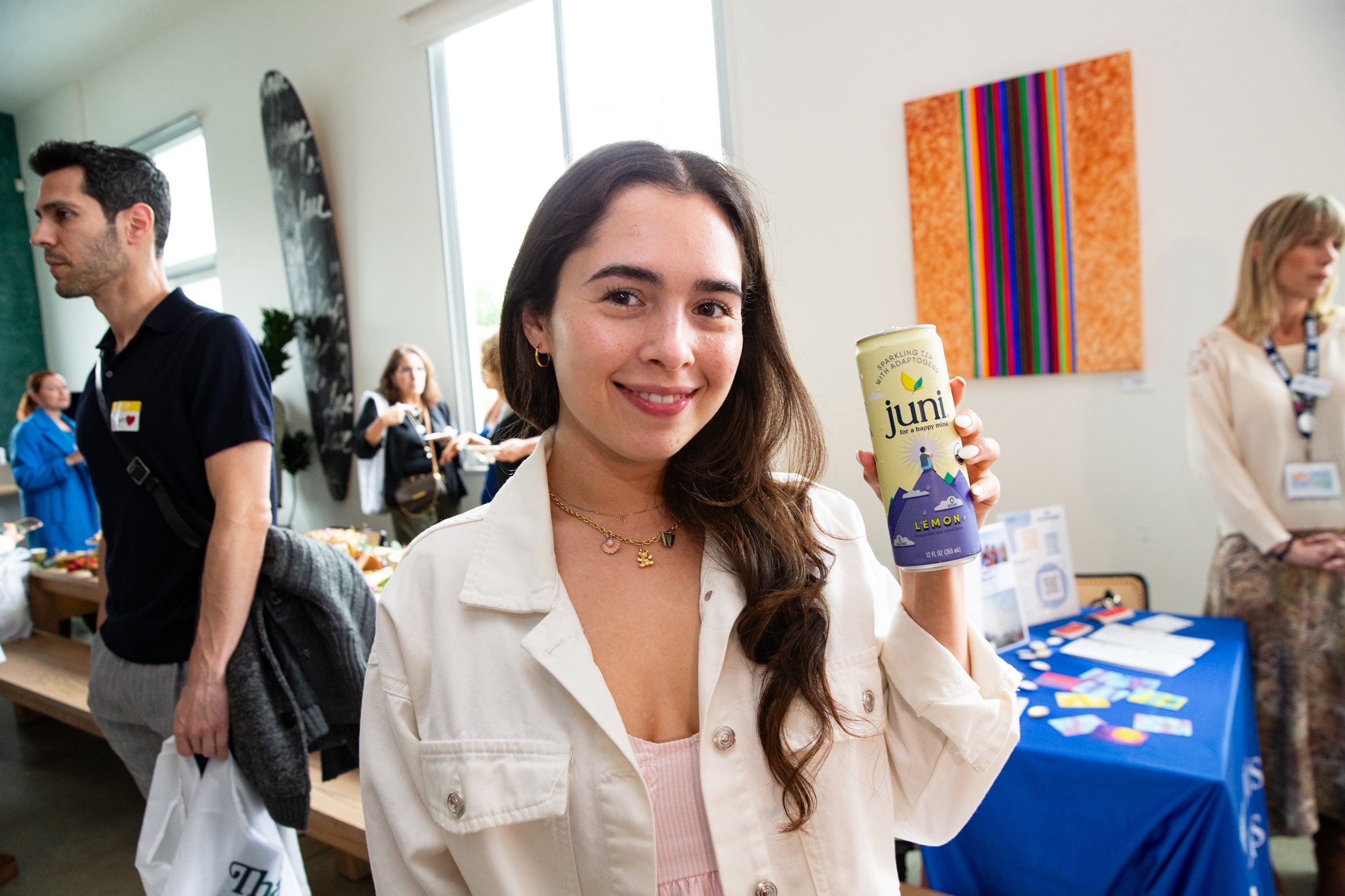 person holding juni drink