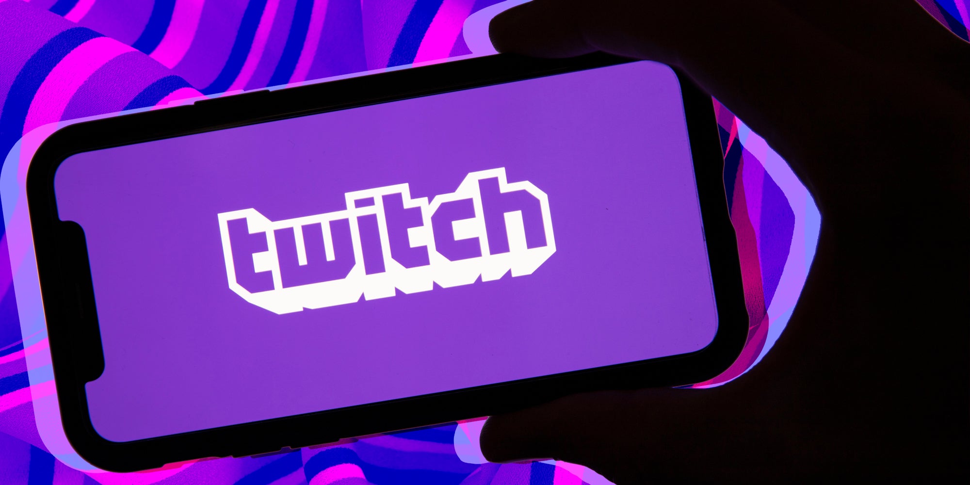 Hand holding phone with twitch app
