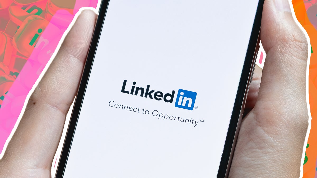 Hangs holding phone with LinkedIn app and abstract background