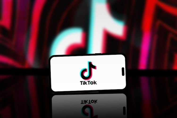 monetization guide - Washington, United States - April 04 2024: TikTok App is displayed on smartphone screen, TikTok logo is blurred in the background. A popular short videos social network on the internet.