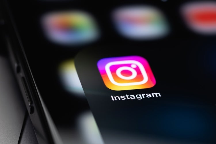 monetization guide - Instagram icon mobile app on a screen smartphone iPhone closeup Instagram is a photo-sharing app for smartphones