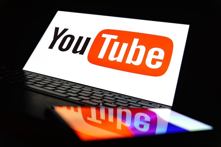 monetization guide - The Youtube video hosting logo on the laptop screen