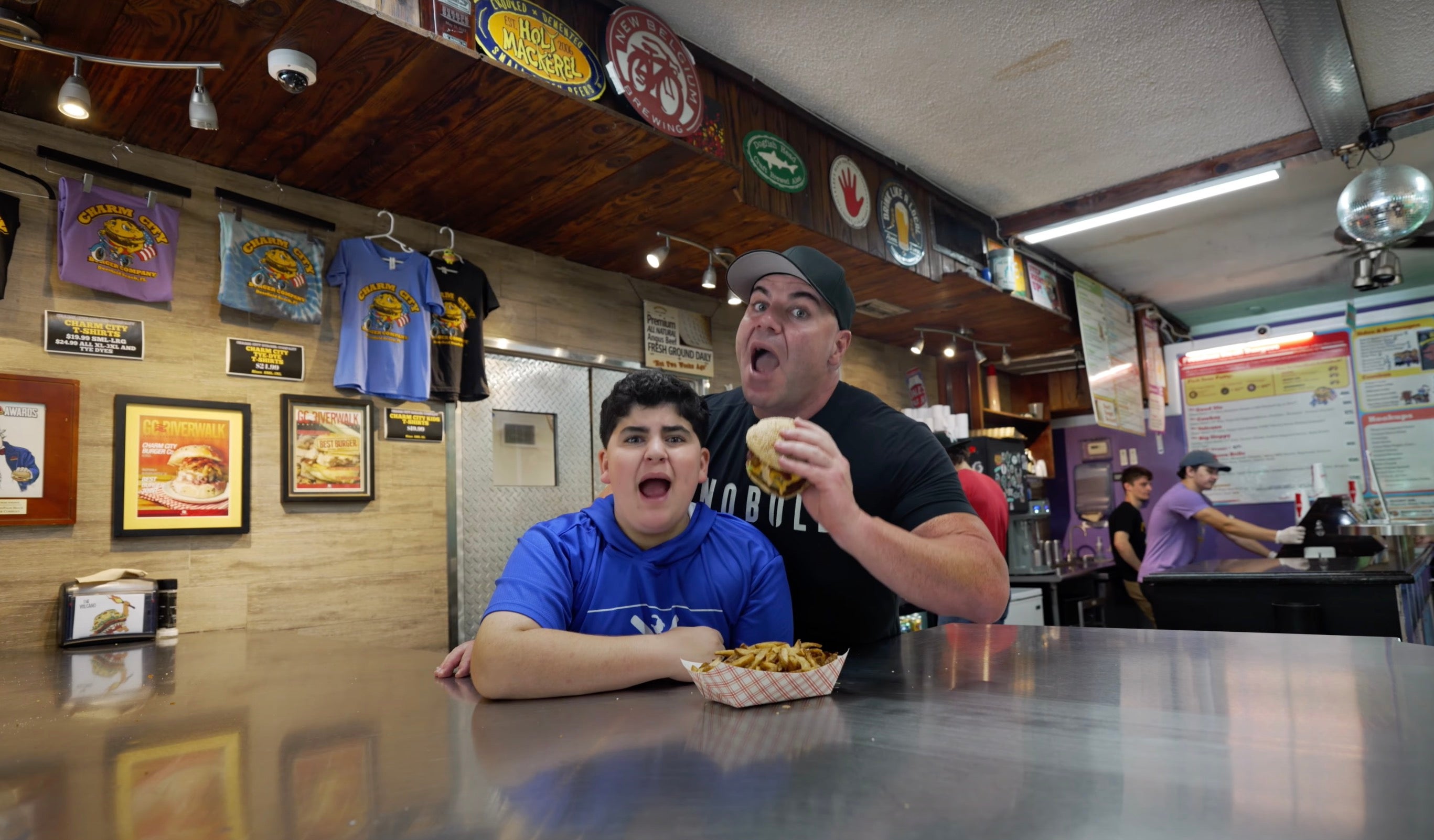 AJ and Big Justice eating a burger