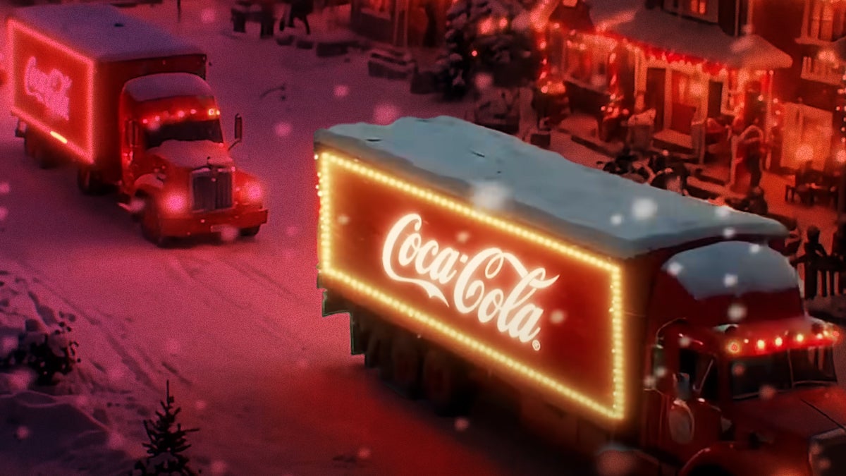 Screenshot from Coca-Cola ai ad with trucks driving in snow