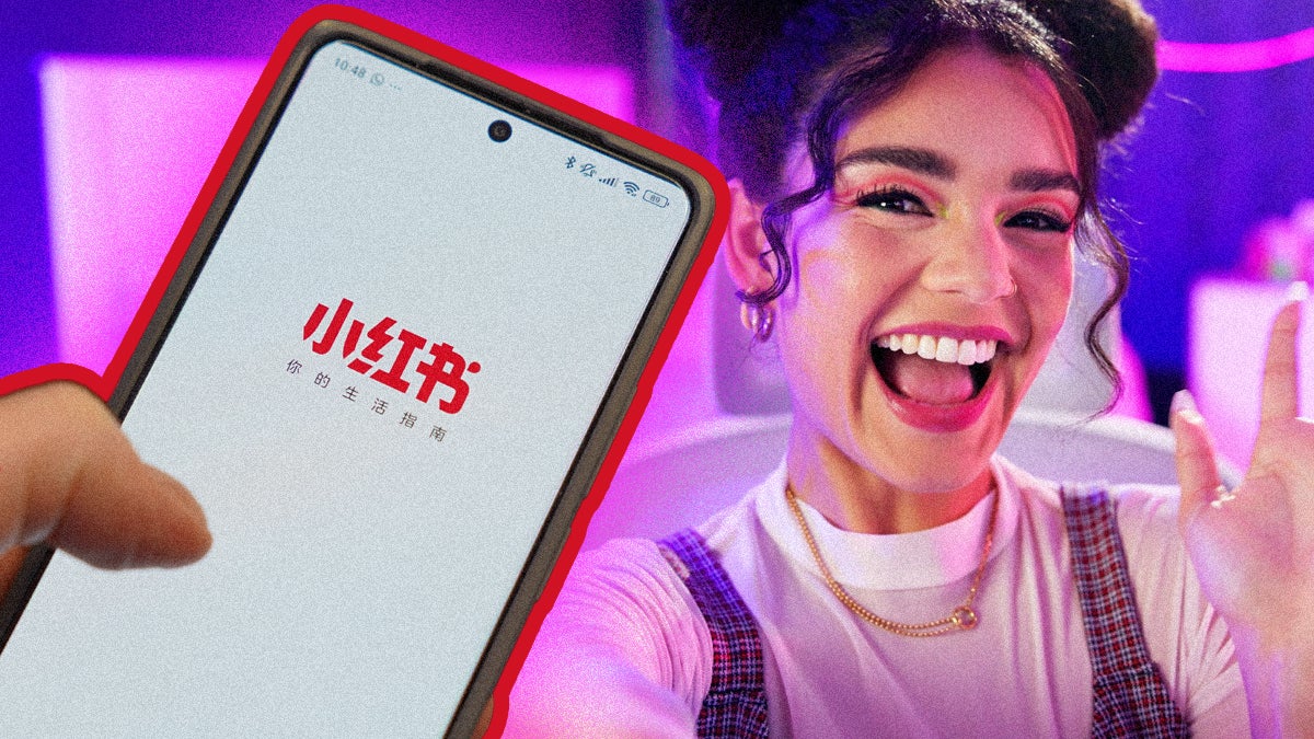 Hand holding phone with red note app and content creator waves in background