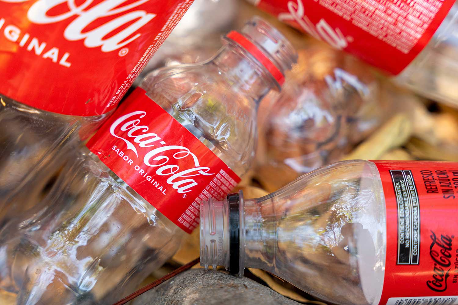 pile of empty coke bottles