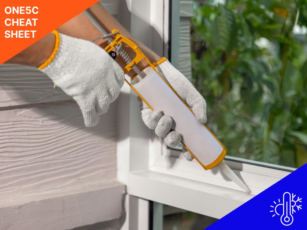 person-caulking-window-seam