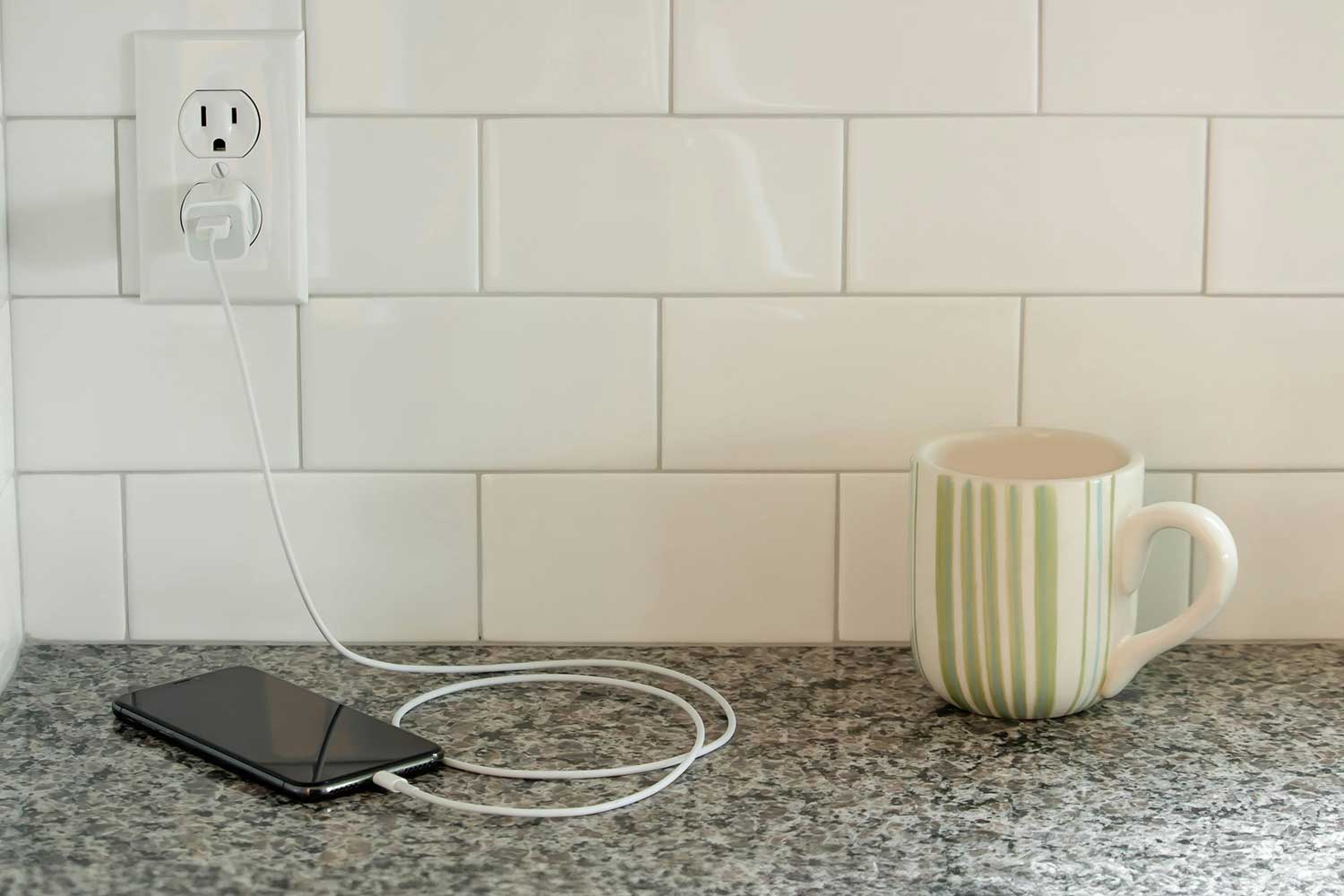 phone charging on kitchen counter
