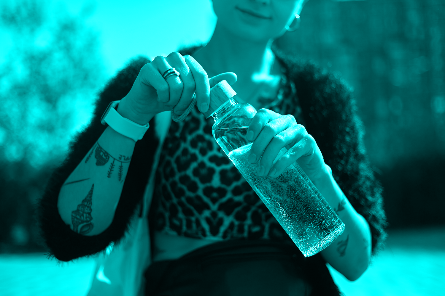 woman opening water bottle