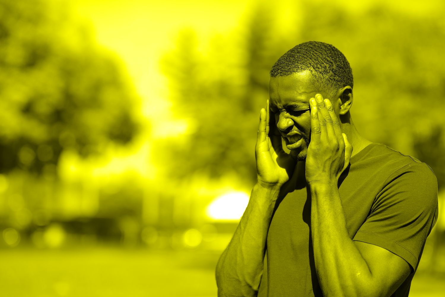 man with headache in heat