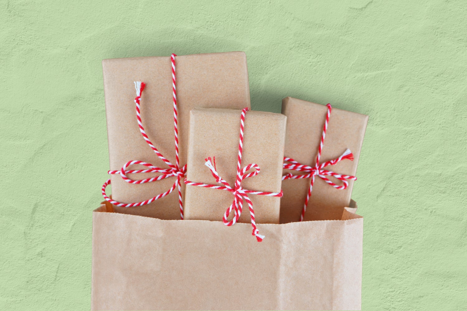 gifts in bag wrapped in brown paper